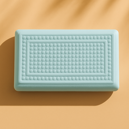Núcleo de la almohada suave Calma de Morfeo con relieve de efecto masaje sobre fondo mostaza.