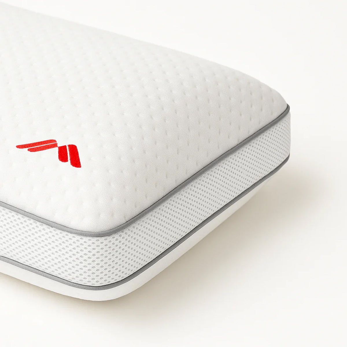 Detalle del lateral de tejido transpirable y ribete gris de la almohada viscoelástica AirHigh de Morfeo.
