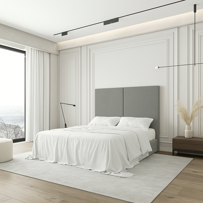 Cabecero Aura color gris de Morfeo en dormitorio moderno con cama y textiles claros.