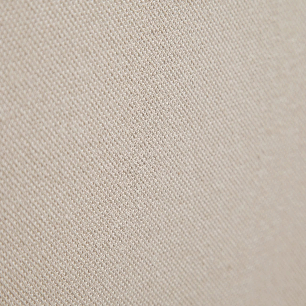 Detalle de la textura de tela beige del cabecero Lin de Morfeo.