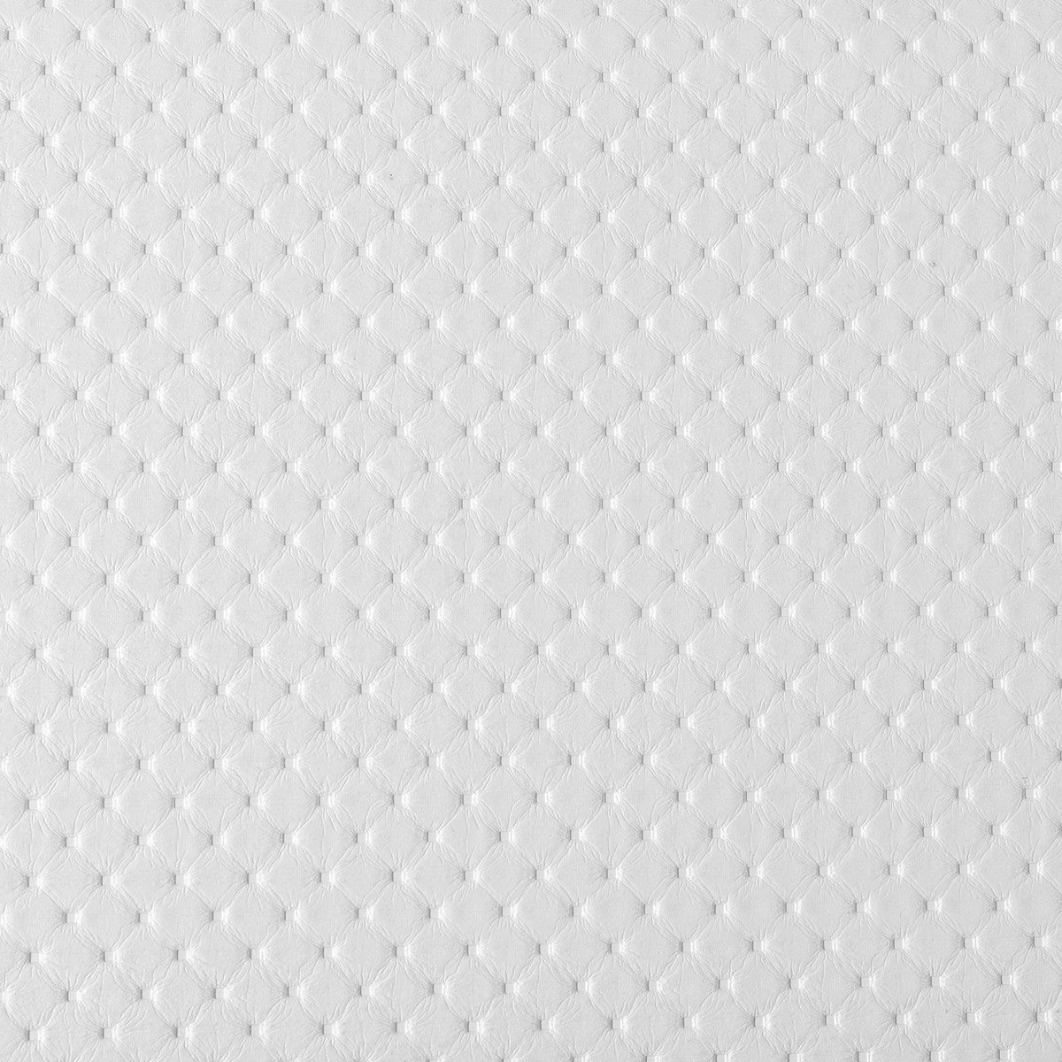Primer plano de la textura microperforada de la tapicería blanca del cabecero Alba de Morfeo.