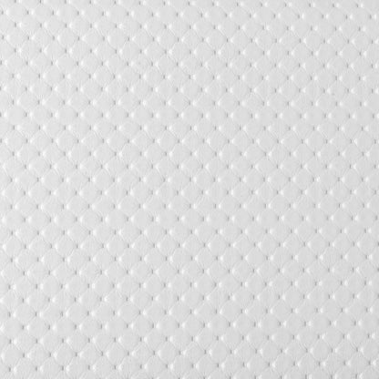 Primer plano de la textura microperforada de la tapicería blanca del cabecero Alba de Morfeo.