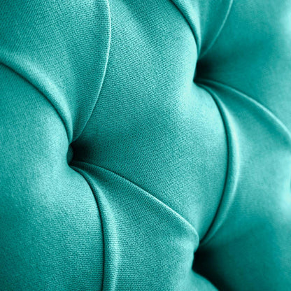 Detalle del tapizado capitoné del cabecero Capy color azul turquesa de Morfeo.