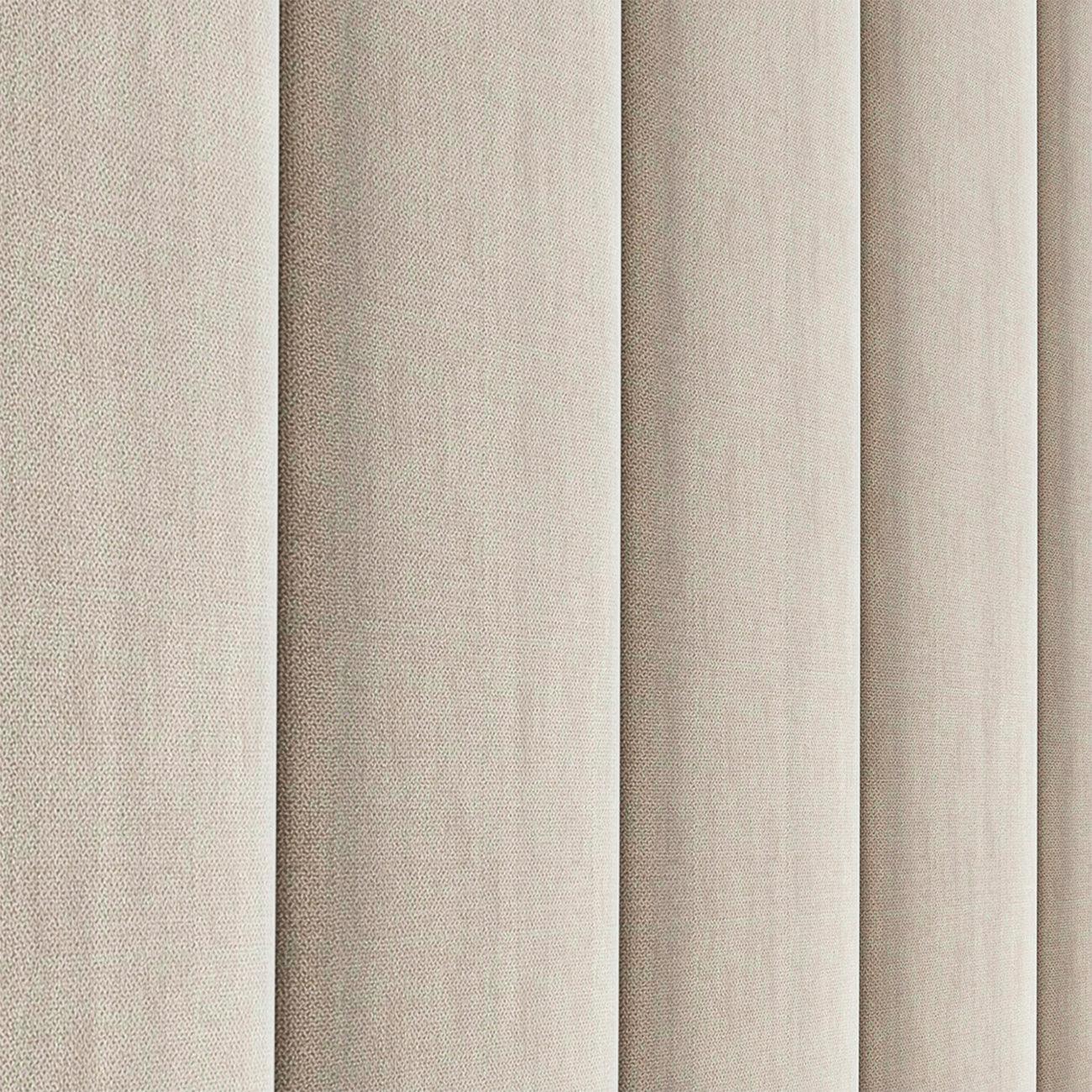 Detalle lateral del cabecero Tasos color beige de Morfeo con tapizado acolchado.