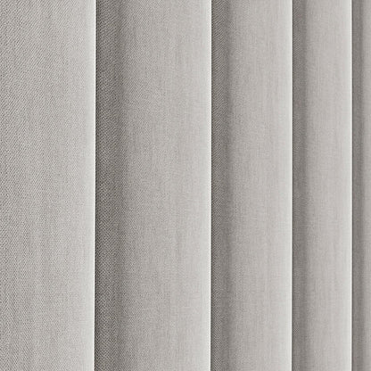 Detalle lateral del cabecero Tasos color gris de Morfeo con tapizado acolchado.