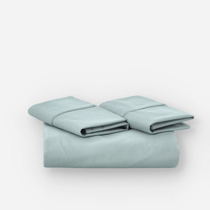 Fundas de edredón EcoPercal aguamarina de Morfeo, conjunto doblado en perspectiva sobre fondo blanco.