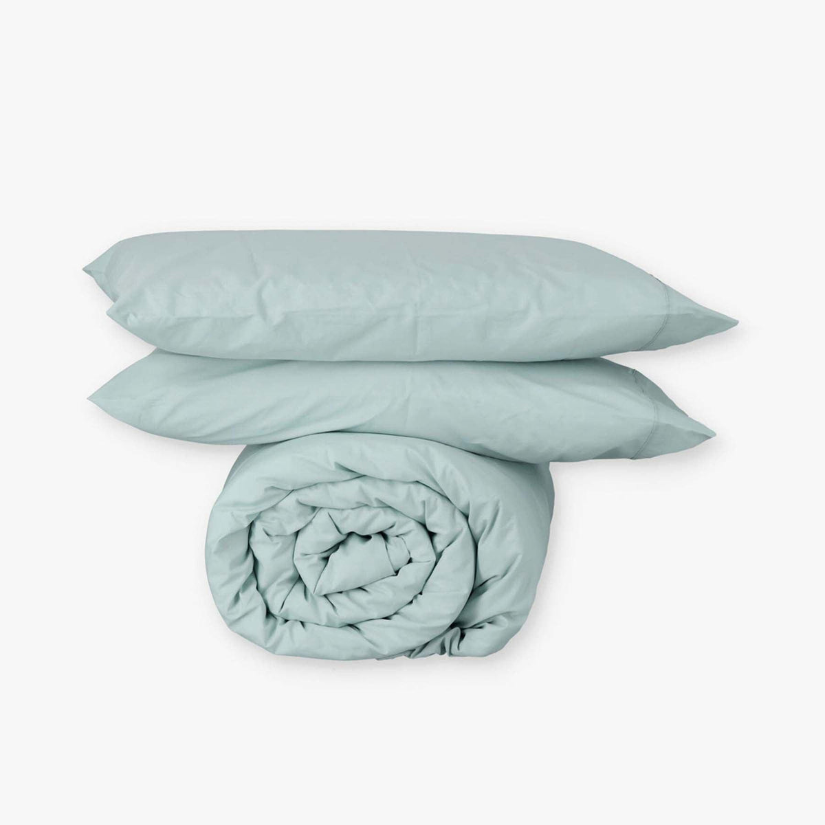Fundas de edredón EcoPercal aguamarina de Morfeo: funda nórdica enrollada con dos fundas de almohada.