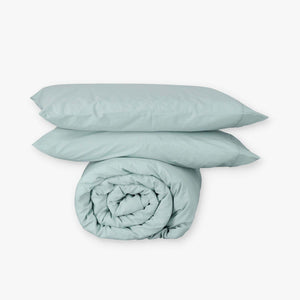 Fundas de edredón EcoPercal aguamarina de Morfeo: funda nórdica enrollada con dos fundas de almohada.