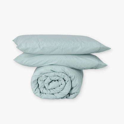 Fundas de edredón EcoPercal aguamarina de Morfeo: funda nórdica enrollada con dos fundas de almohada.