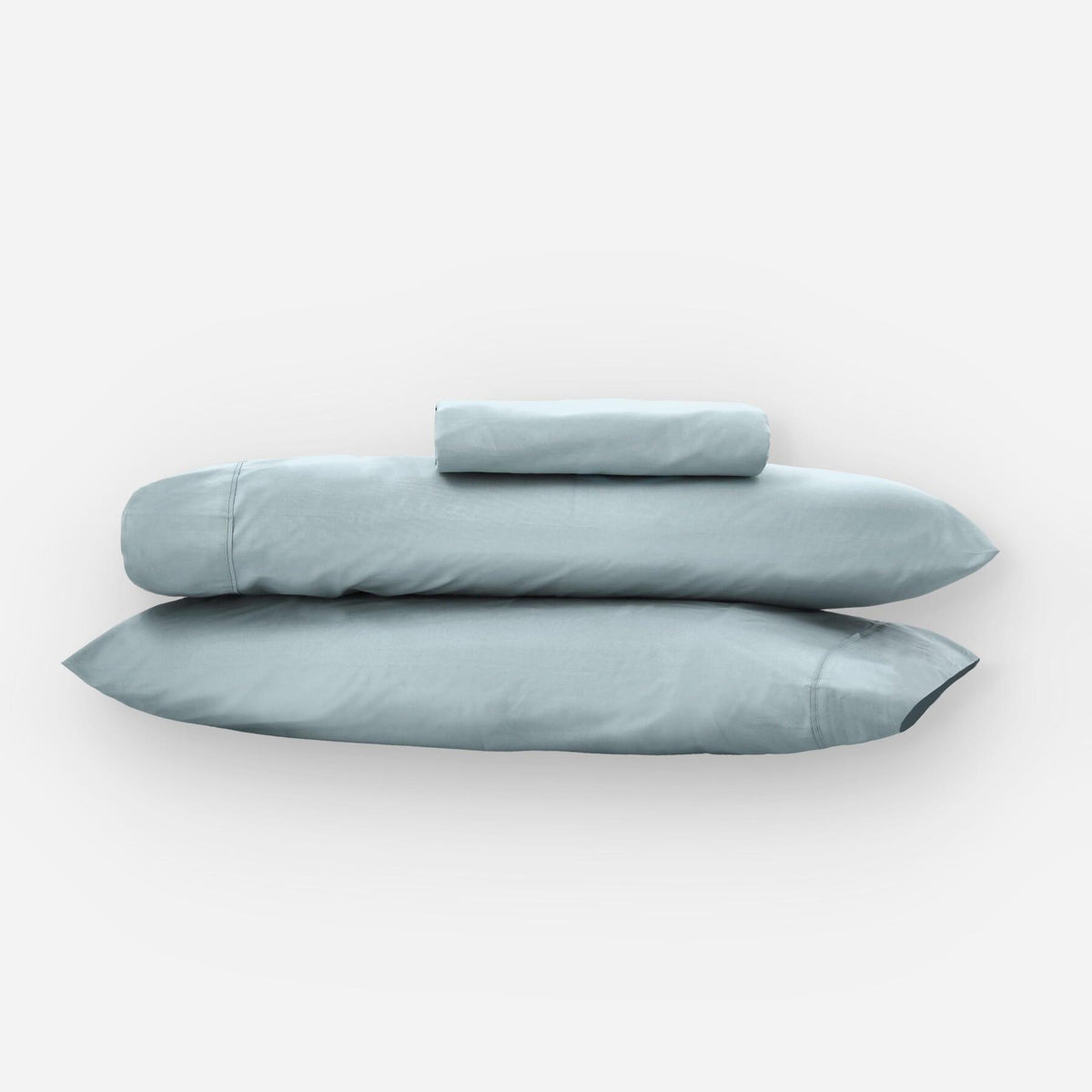 Fundas de edredón EcoPercal aguamarina de Morfeo: dos fundas de almohada apiladas sobre fondo blanco.
