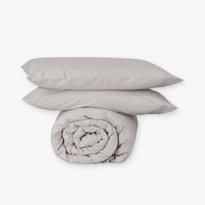 Fundas de edredón EcoPercal gris de Morfeo: funda nórdica enrollada con dos fundas de almohada.