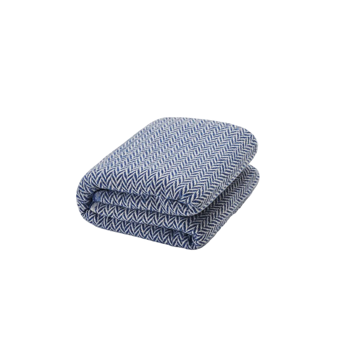 Mantita espiga azul de Morfeo doblada sobre fondo blanco, con tejido en espiga azul y blanco.